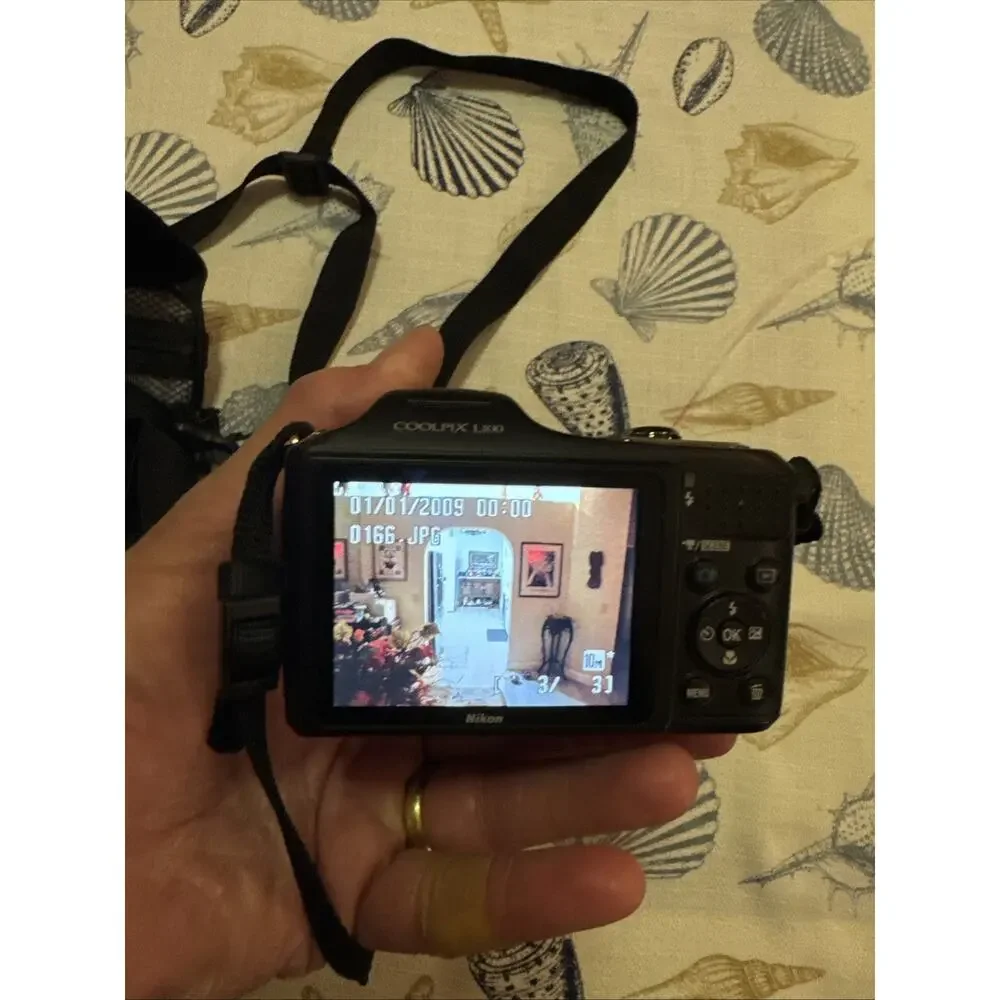 Nikon Black Camera with Matching Black Carry Case and Red Trim